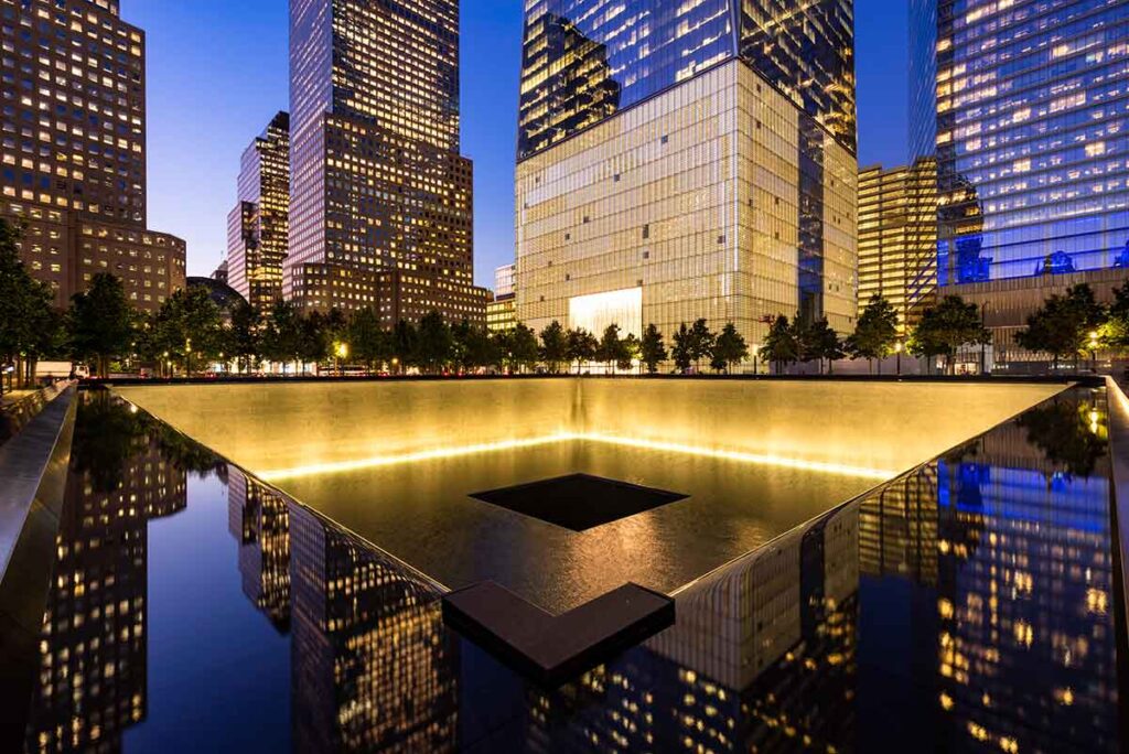 9/11 Memorial reflecting pool surrounded by trees