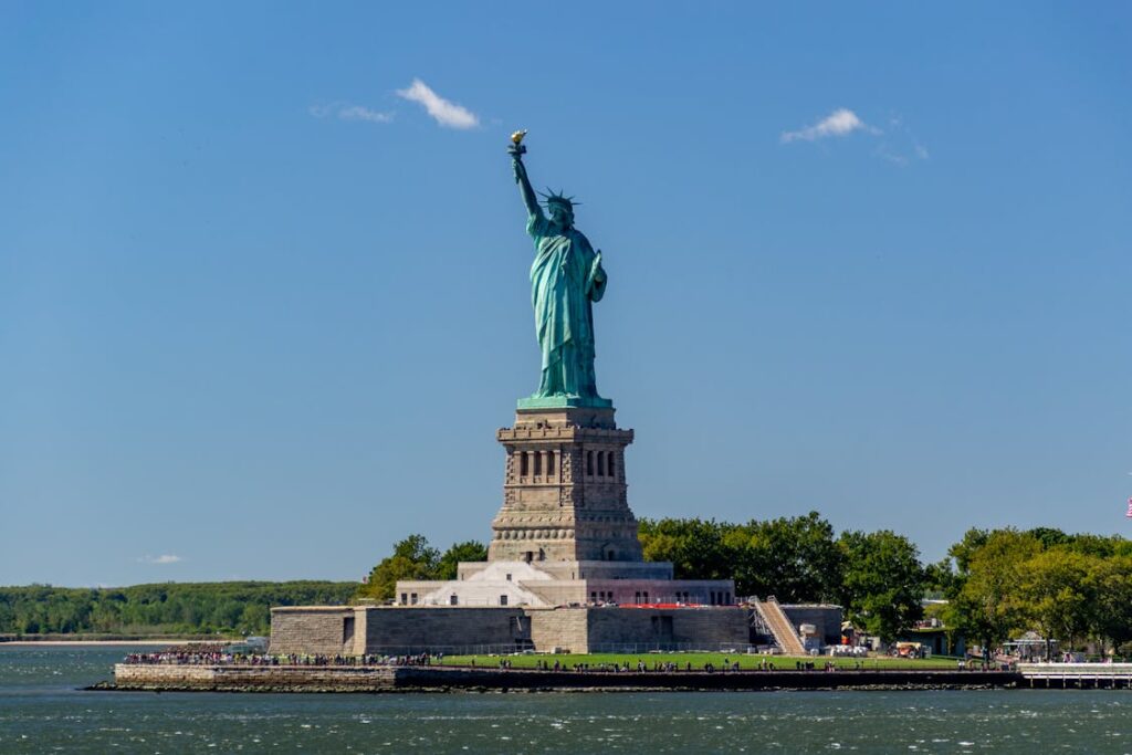 Statue of Liberty under a bright blue sky